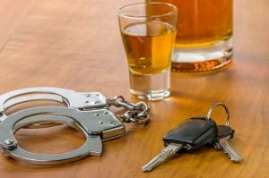 Alcohol Drink, Handcuffs, and Car Keys